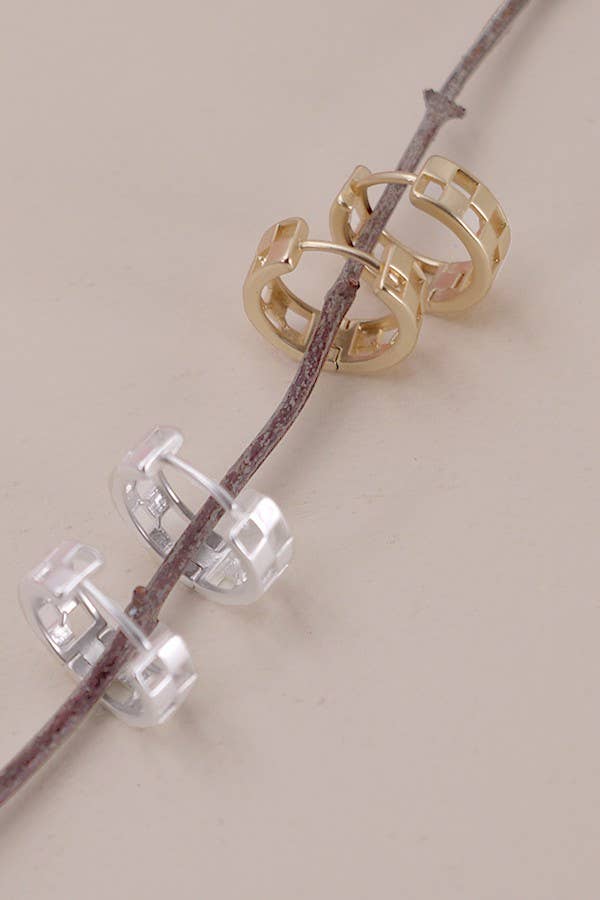 Mini checker cutout huggie hoop earrings in matte gold or silver, featuring a modern geometric design and a snug, comfortable fit.