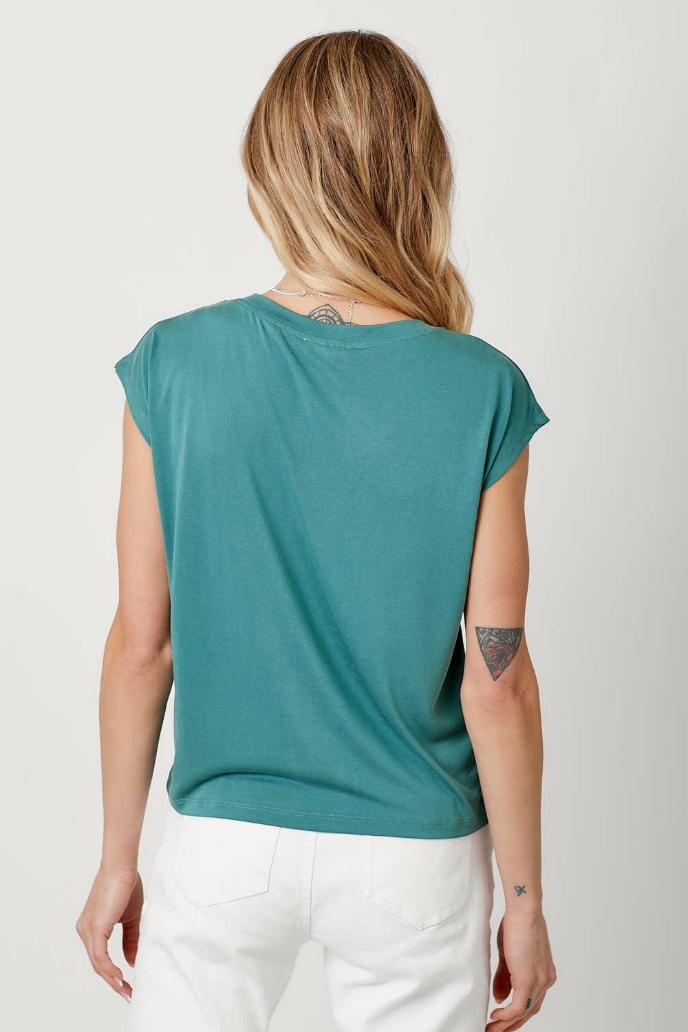 Teal ruched front cap sleeve top with v-neck and drawstring detail.