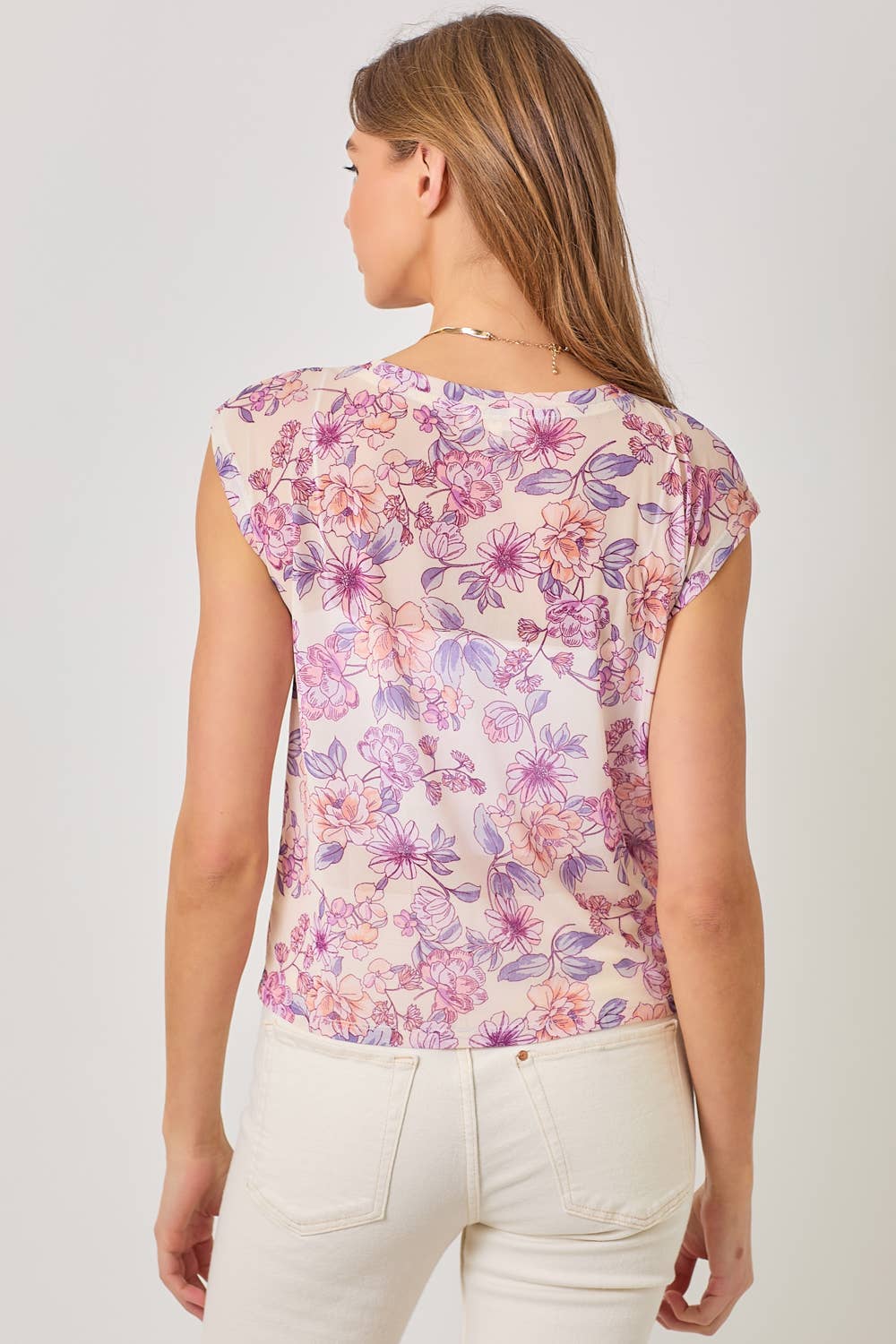 Ivory mesh floral top with ruched front drawstring and cap sleeves.