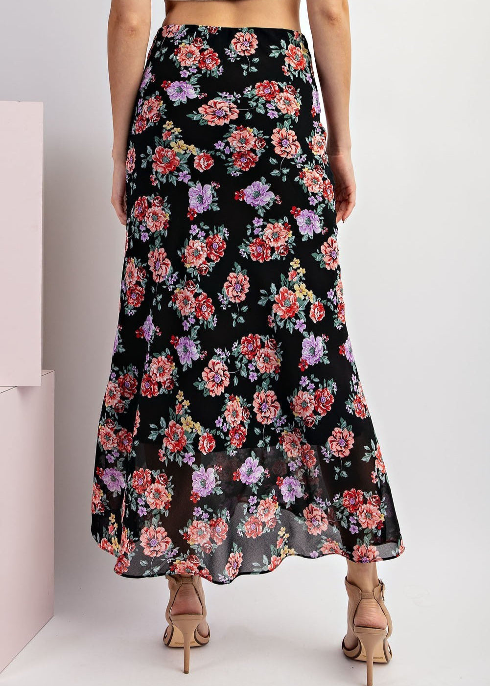 Black floral maxi skirt with red and purple blooms and A-line silhouette.