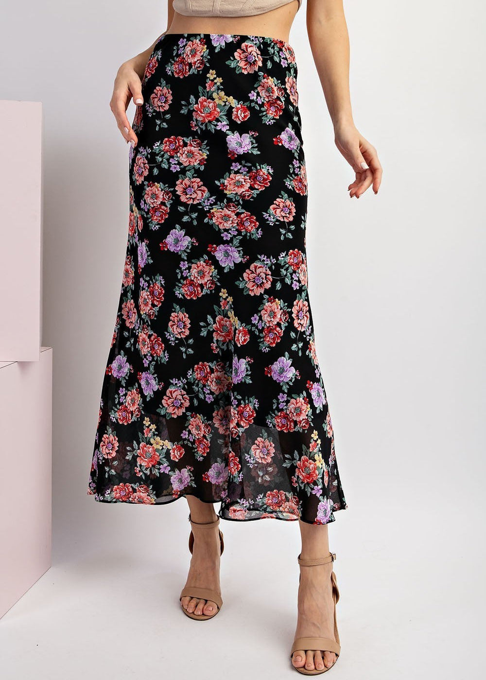 Black floral maxi skirt with red and purple blooms and A-line silhouette.