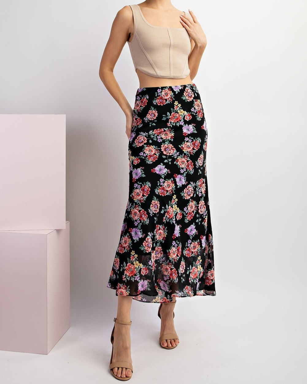 Black floral maxi skirt with red and purple blooms and A-line silhouette.