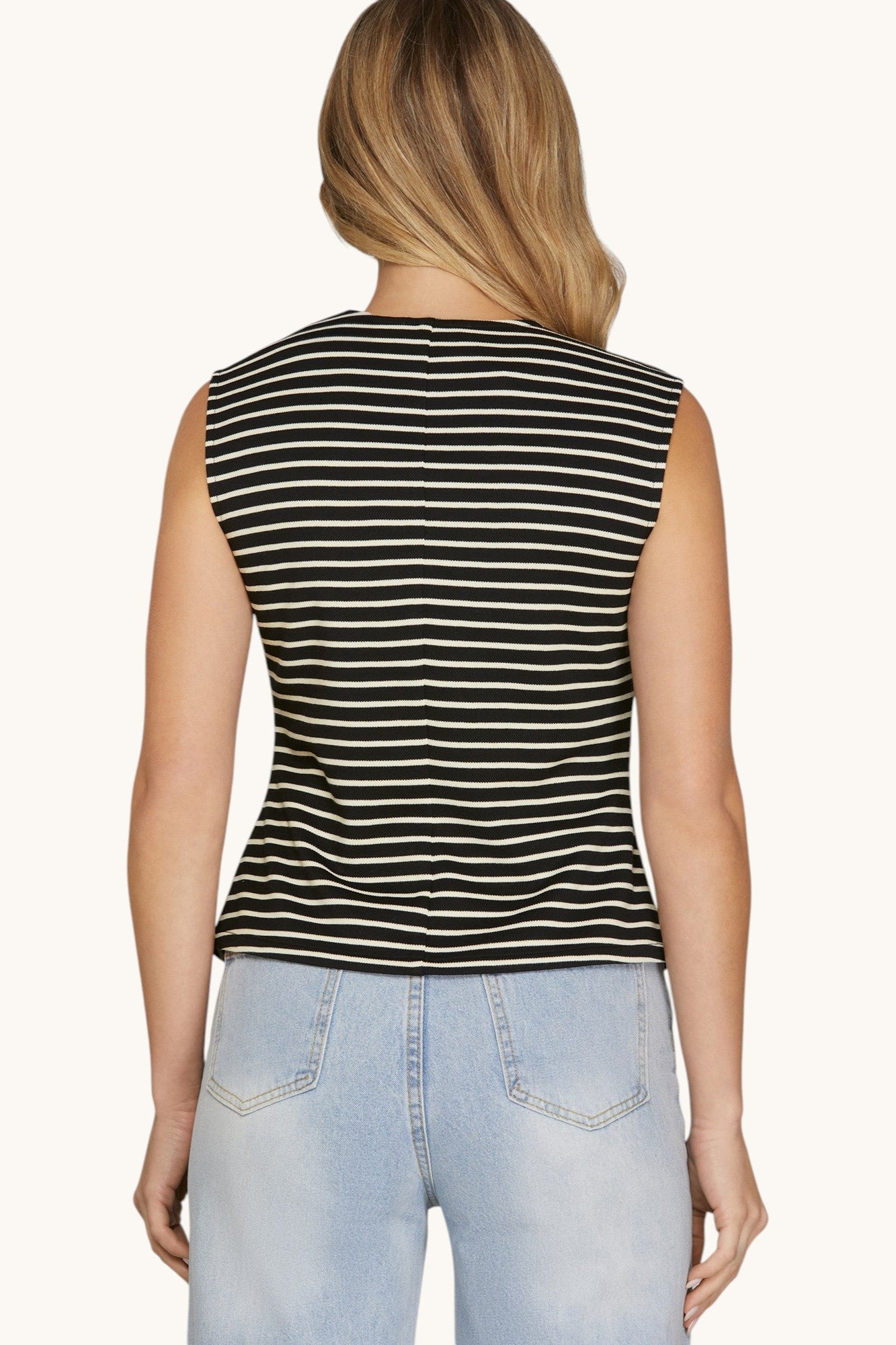 Back view of a black sleeveless vest with Ivory stripes.