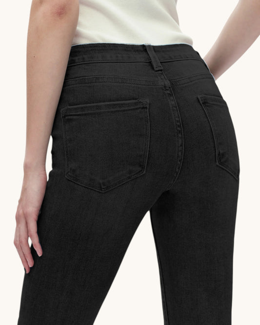 Black pants worn by a person on a white background.