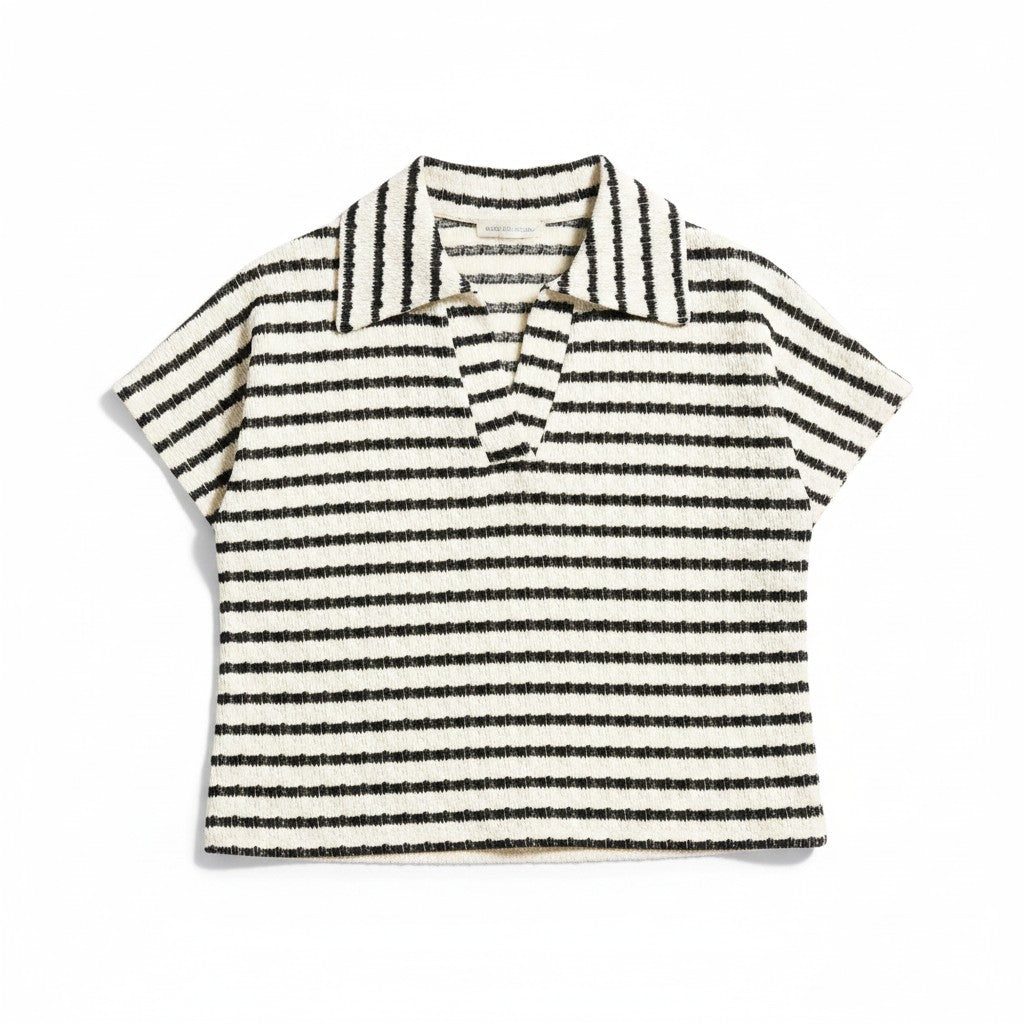 Black and white striped polo shirt on a white background.