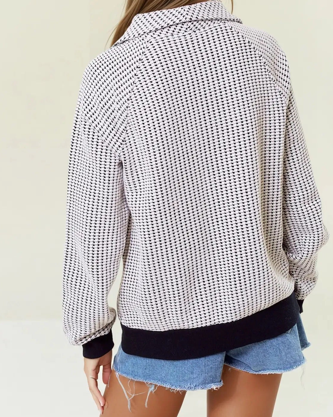 Two-tone black and white cotton waffle collared sweatshirt.