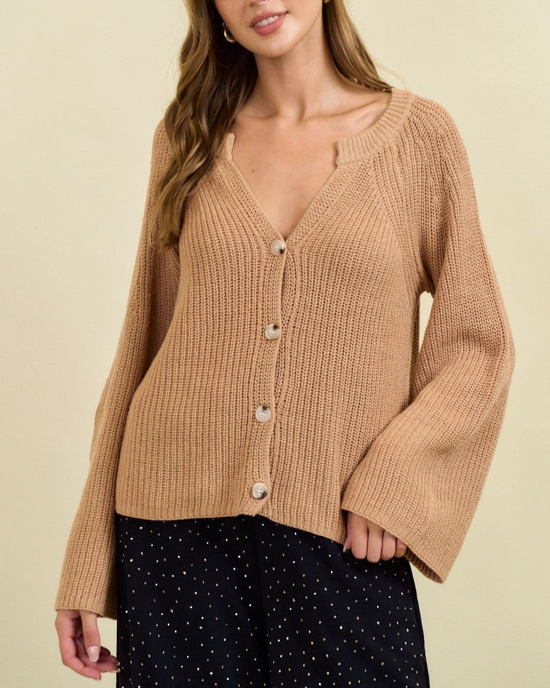 Tan ribbed button cardigan with blouson sleeves and gold buttons.