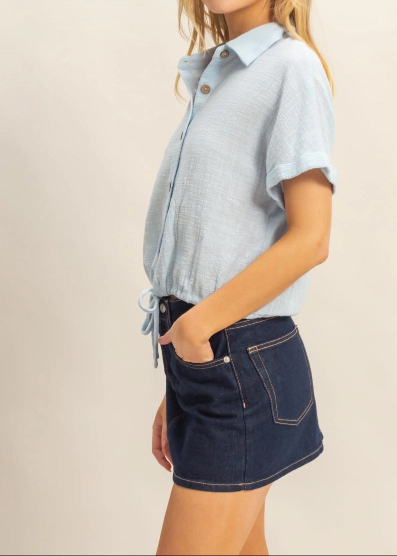 Sky Blue short sleeve 100% cotton button-up shirt with drawstring hem.