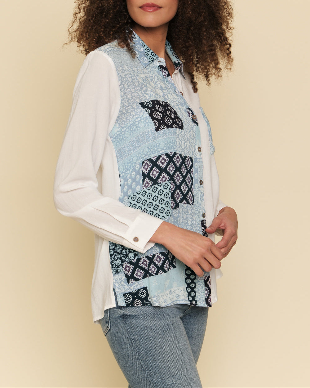 White and blue mixed print button-down shirt with bust pocket.