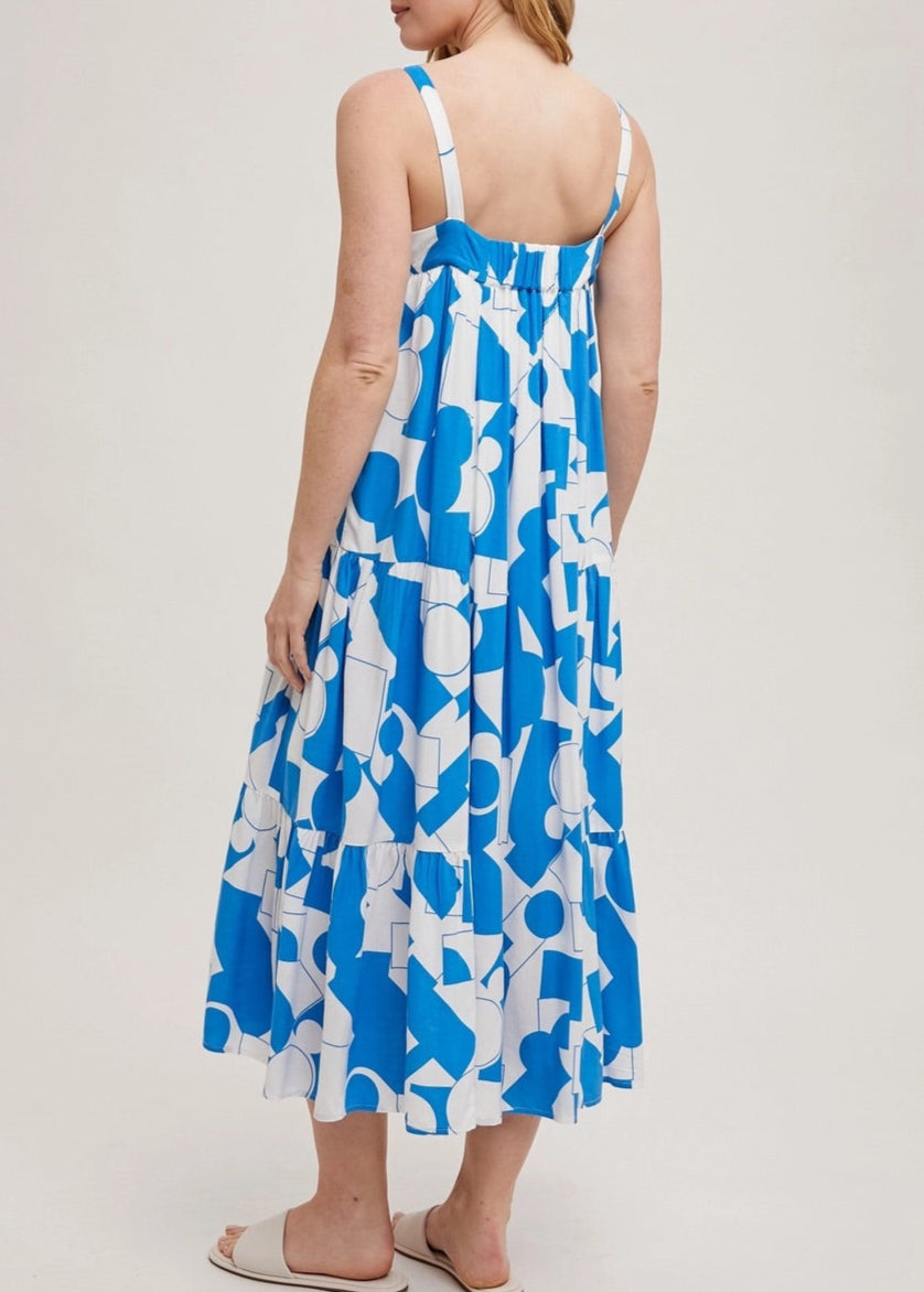 Blue and white geometric print tiered maxi dress with adjustable straps.