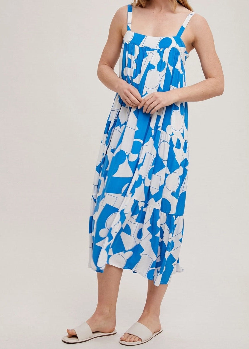 Blue and white geometric print tiered maxi dress with adjustable straps.