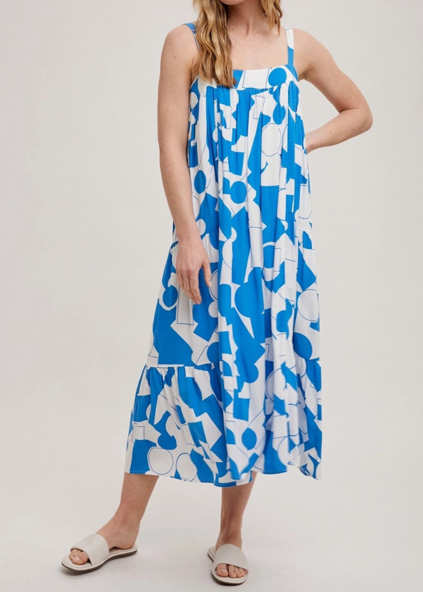 Blue and white geometric print tiered maxi dress with adjustable straps.