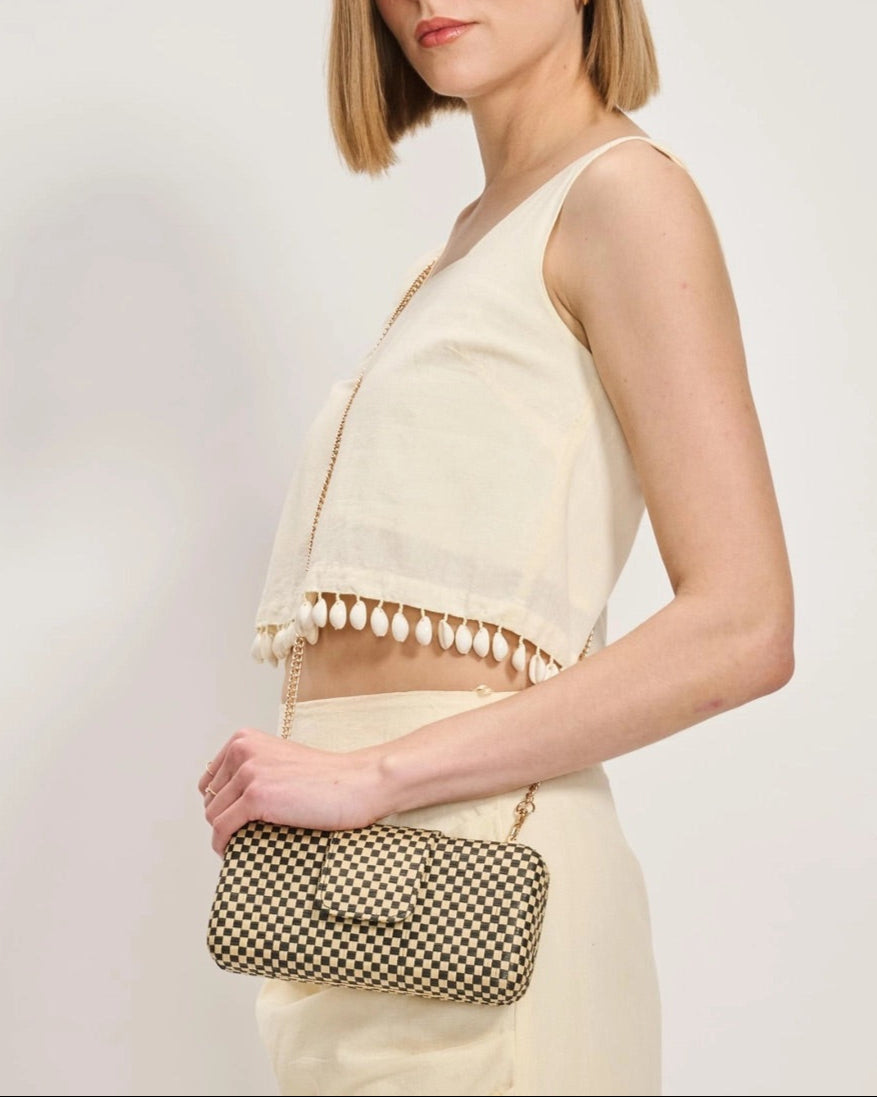 Black and Natural Checkered crossbody bag with chain strap.