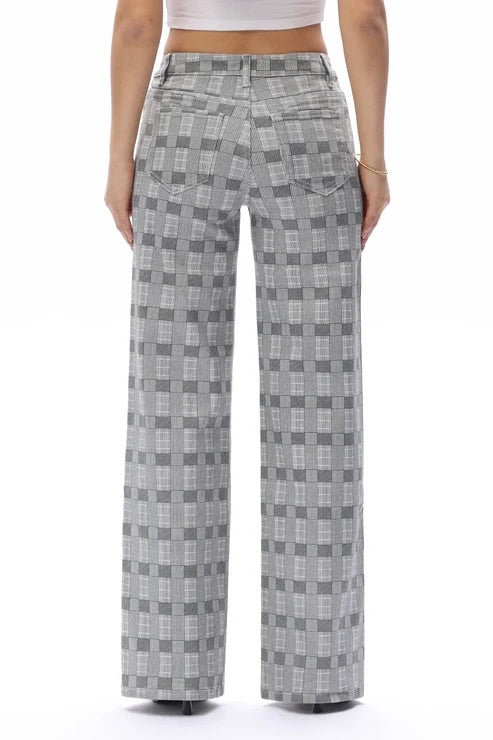 Charcoal and gray denim jeans shown from a back view from the waist down.