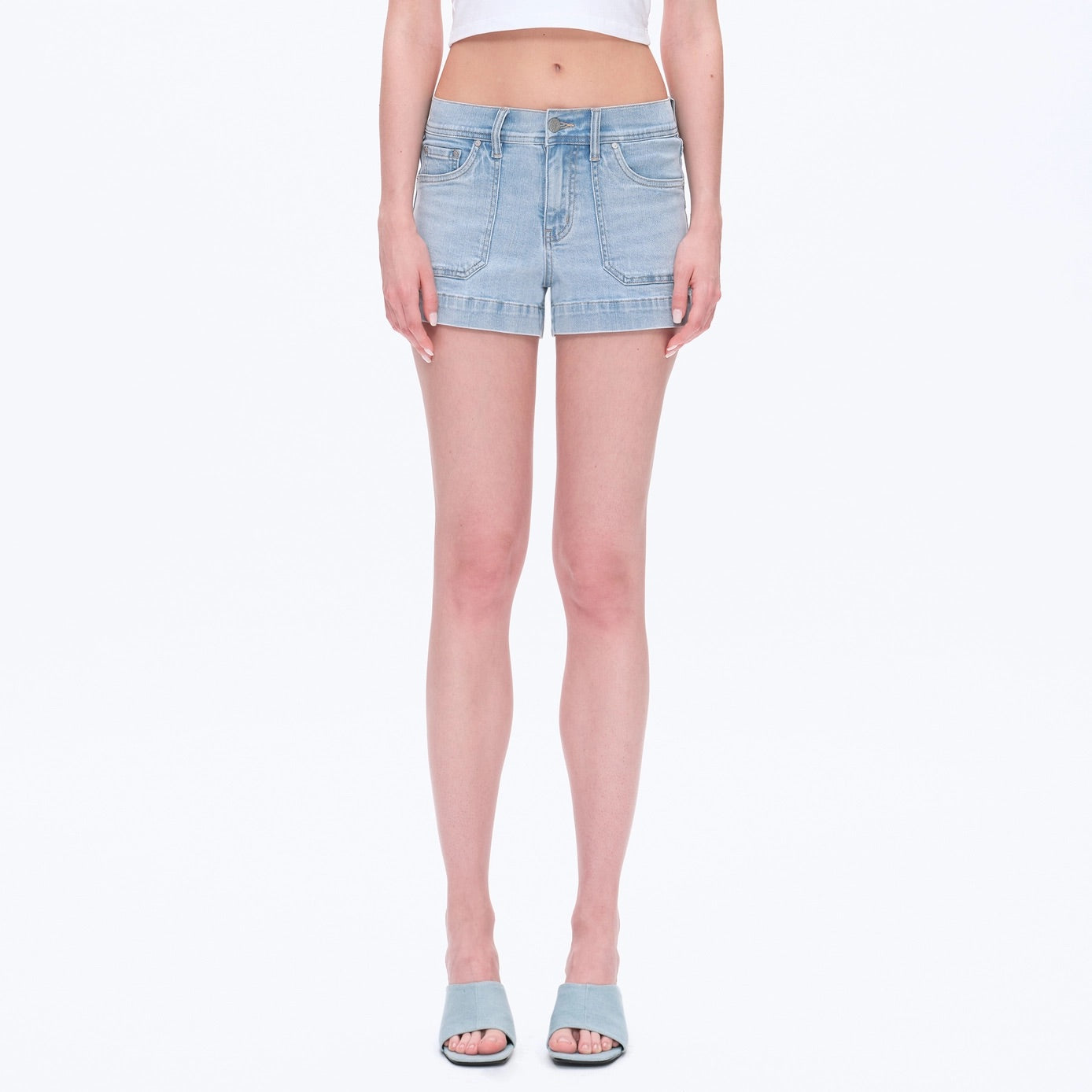 Light blue mid-rise denim shorts with finished hem, elastic waistband, and classic five-pocket style.