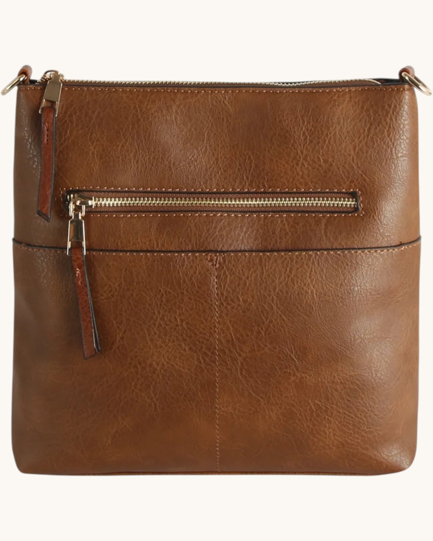 Brown leather crossbody bag with a gold zipper on a white background.