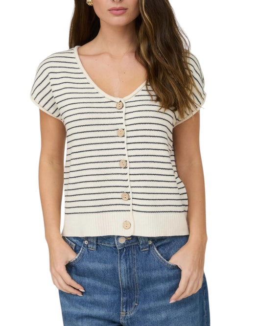 Woman wearing a Cream and Navy striped short sleeve button up cardigan.