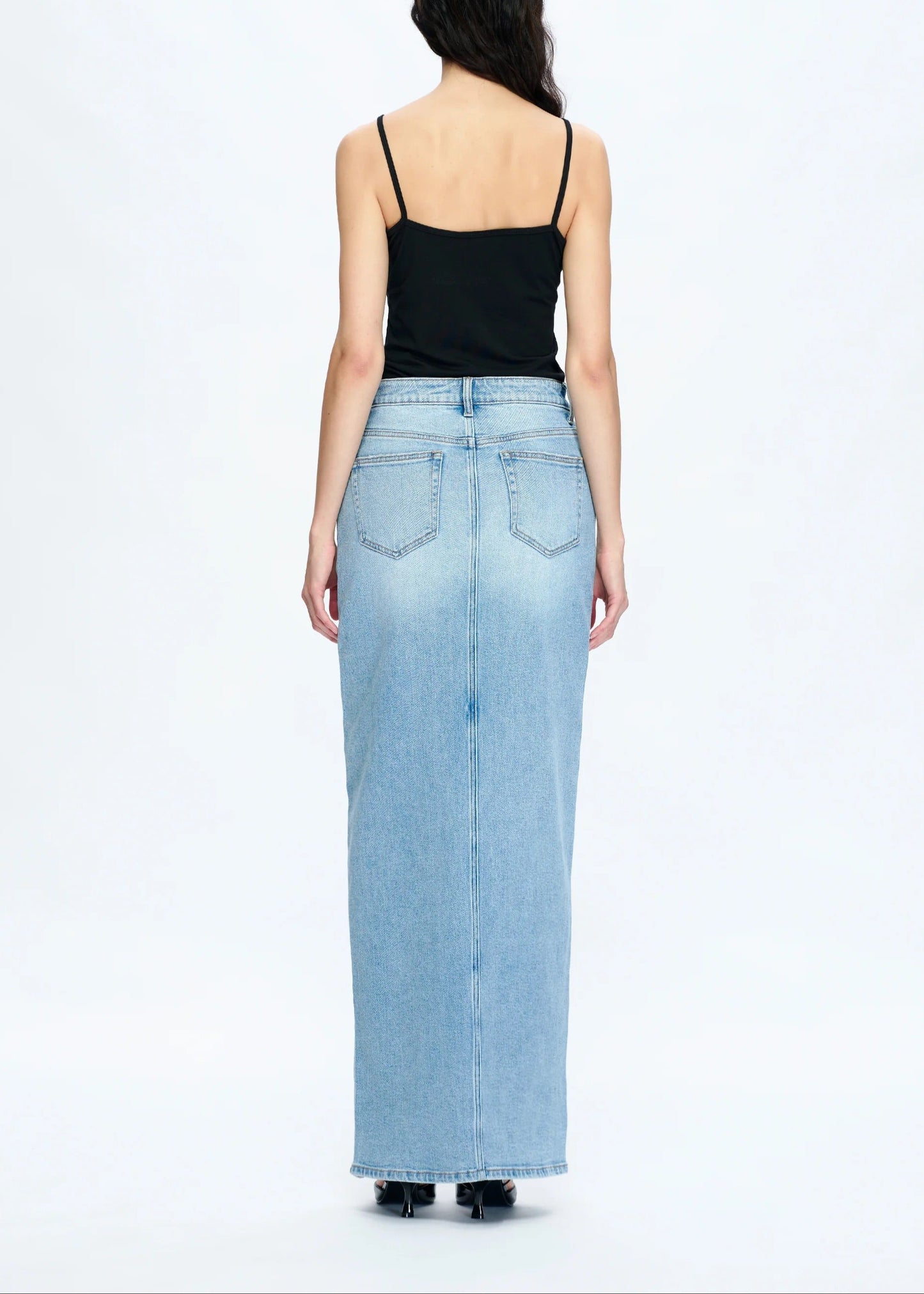 Periwinkle blue denim maxi skirt with front slit, mid to high-rise waist.
