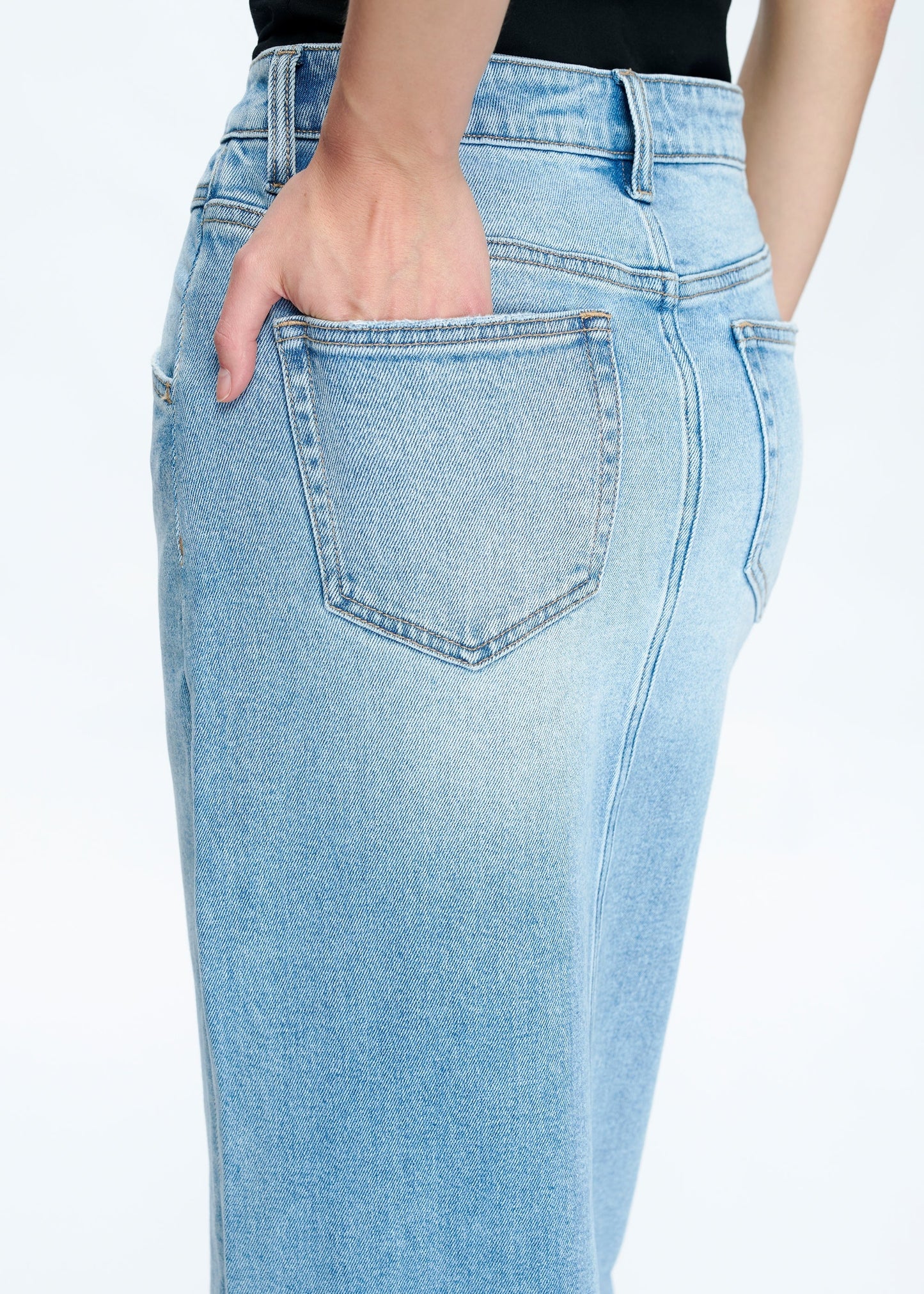 Periwinkle blue denim maxi skirt with front slit, mid to high-rise waist.