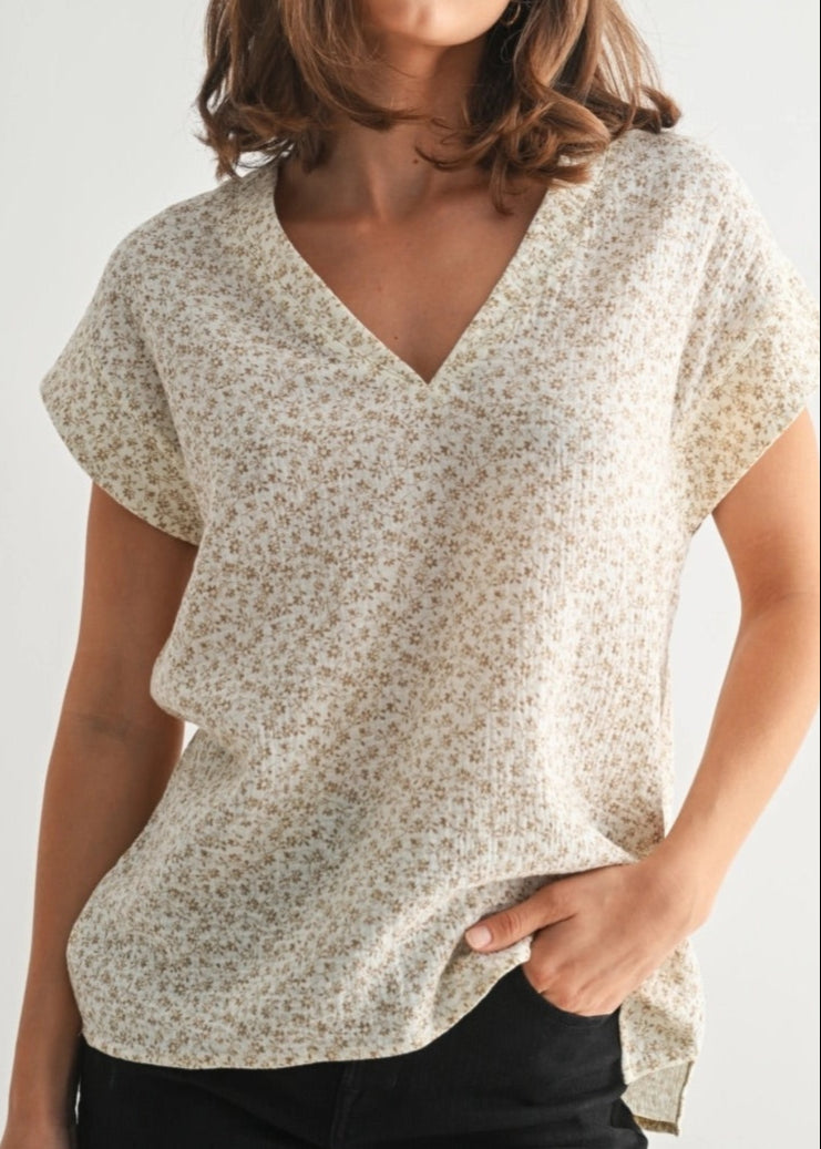 Cream short sleeve cotton top with delicate ditsy floral print.