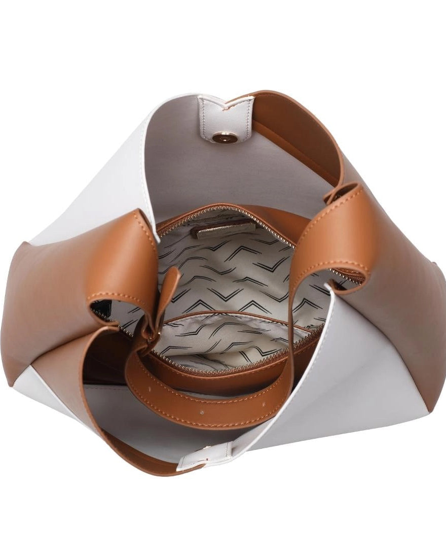 Interior view of black and white handbag on a white background.