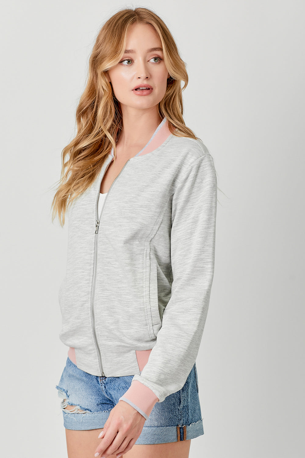 Heather grey bomber jacket with pink and silver contrast details on hem, sleeves and neckline.