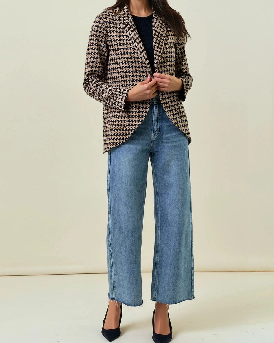 Woman wearing a Houndstooth Shawl Blazer Black and Mocha with open front and modern collar.