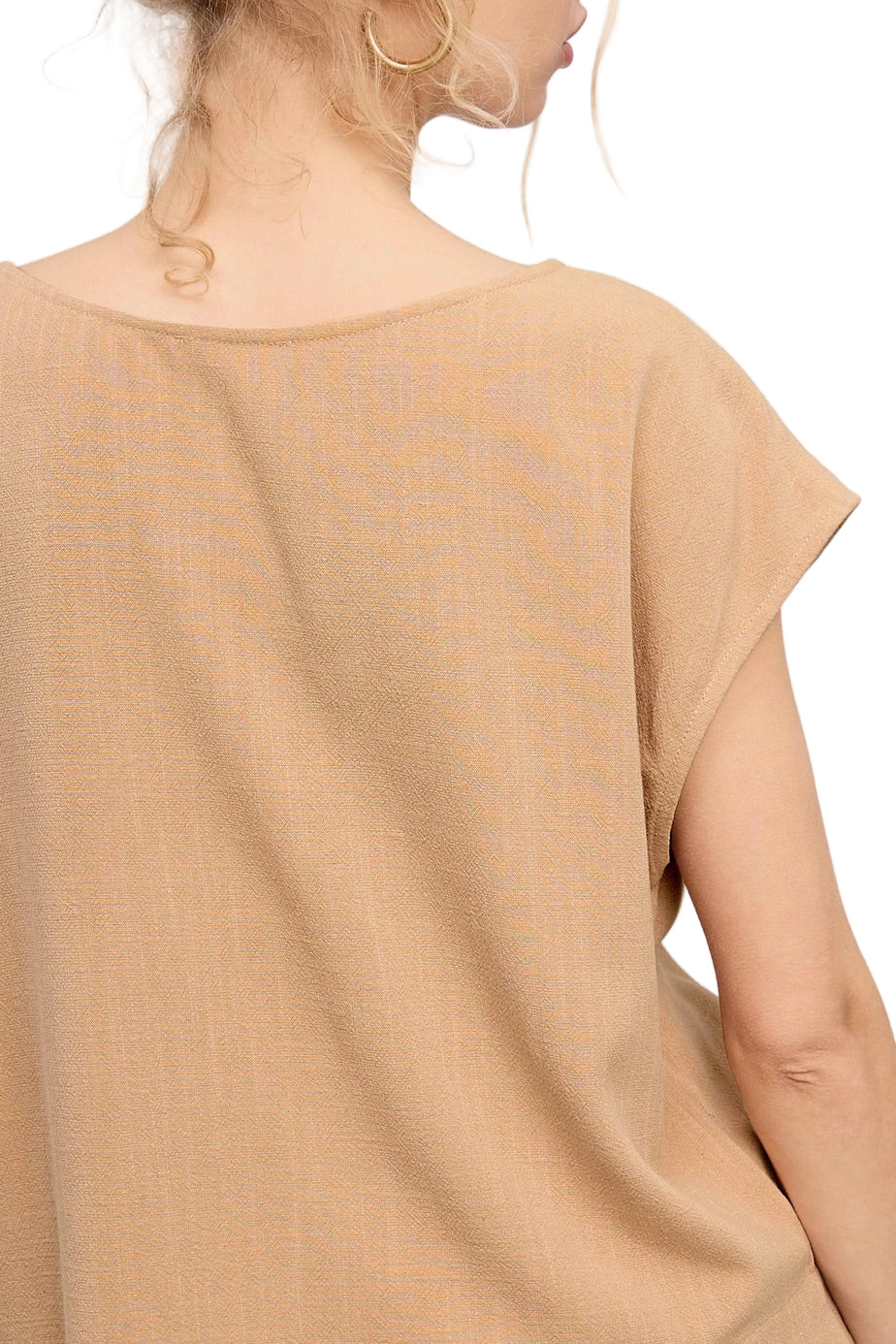 Woman wearing a Khaki linen-blend cap sleeve top with round neckline and side slits.