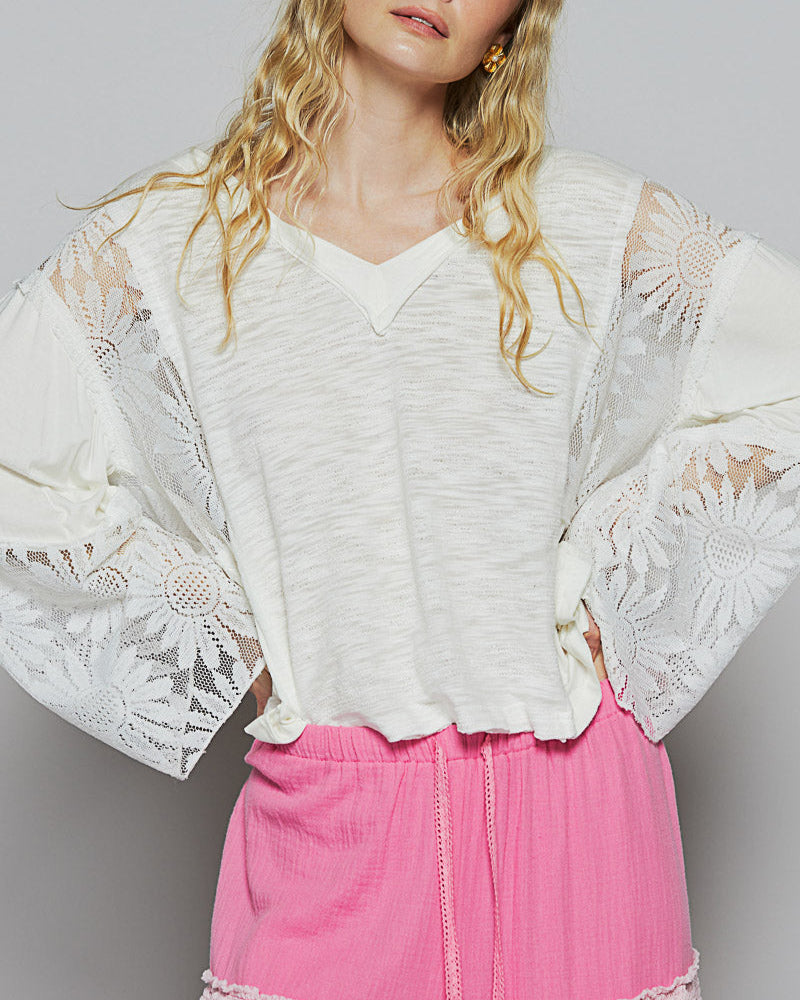 White V-neck relaxed-fit boho top with flare sleeves and floral lace detailing.