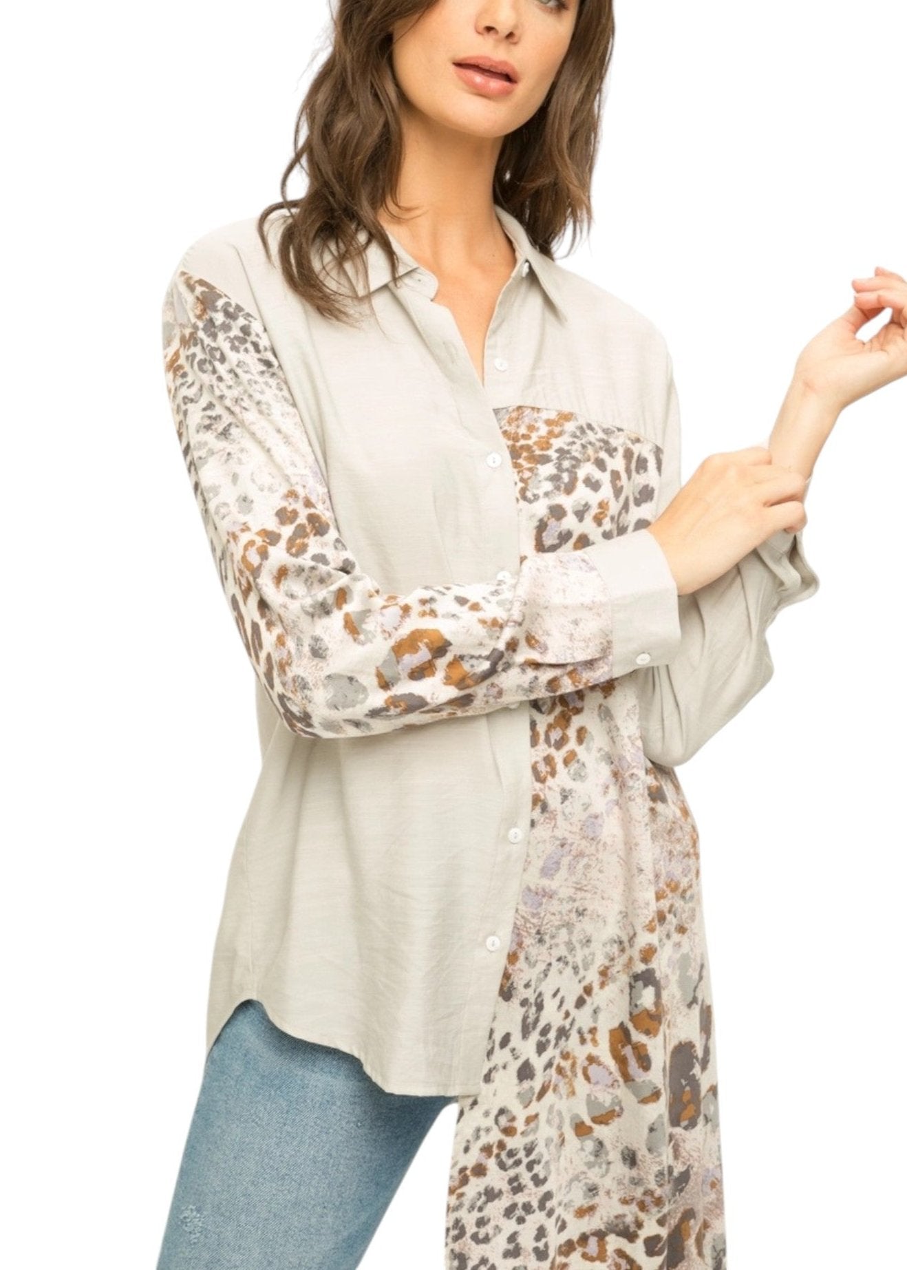 Leopard Luxe High-Low Button-Up Top with scarf-style leopard print inset, long sleeves, and asymmetrical hem in neutral tones.