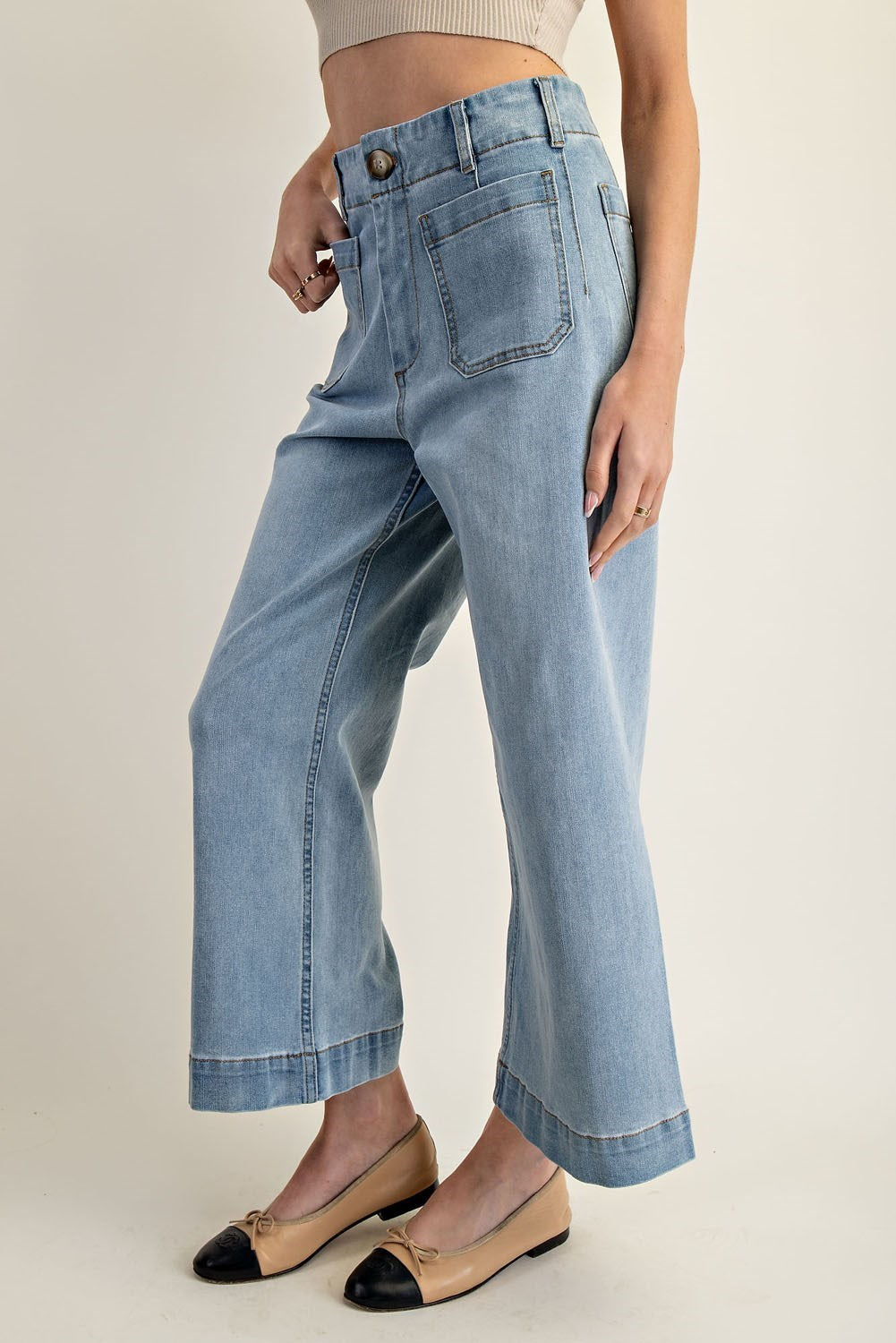 Light wash wide-leg cropped denim jeans with front patch pockets and contrast seaming.