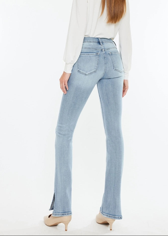 Kan Can Mid-Rise Split Hem Medium Wash Bootcut Jeans with flattering fit and side slit hem.