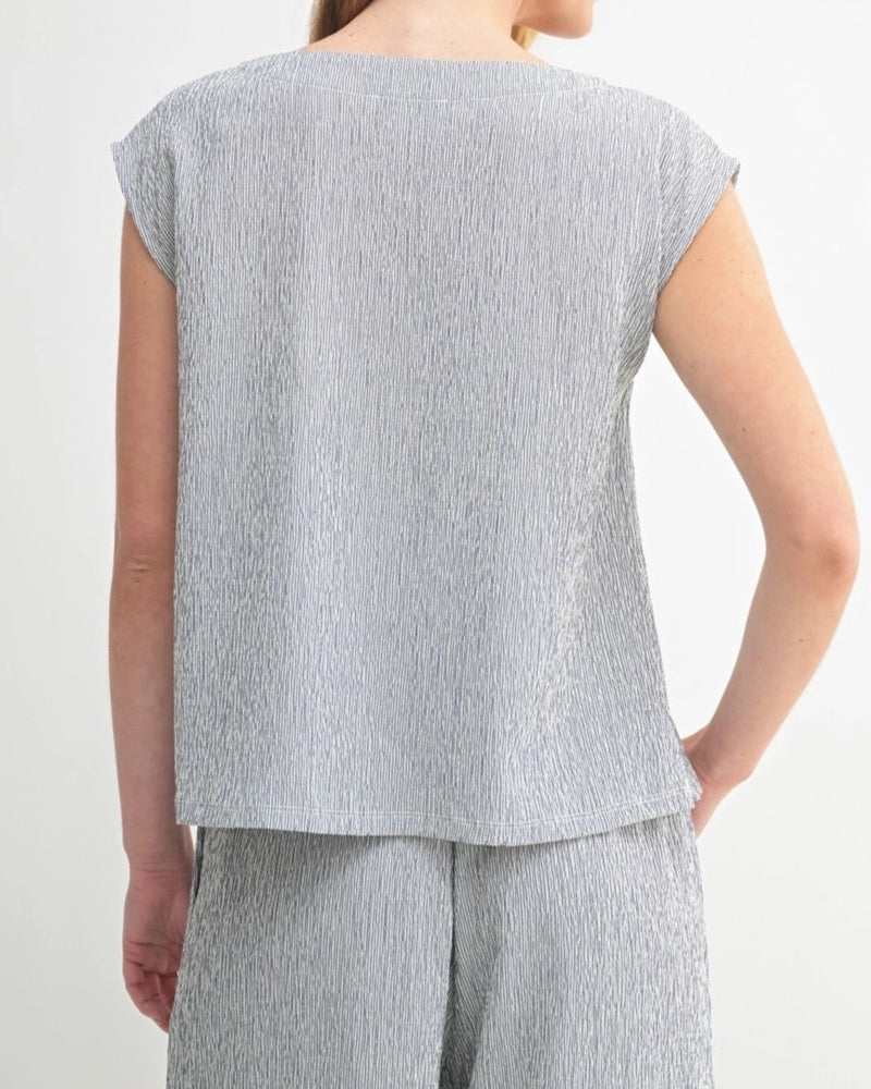 Navy sleeveless top with heathered texture and modern cut.