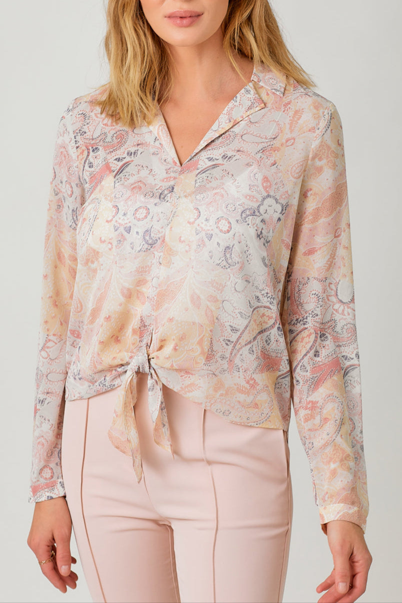 Semi-sheer pastel paisley tie-front blouse with V-neck and hi-lo hem.