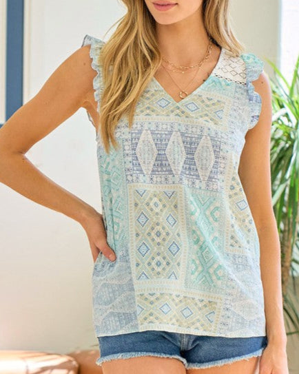 Sleeveless ruffle top with sea green mosaic print and lace trim neckline.