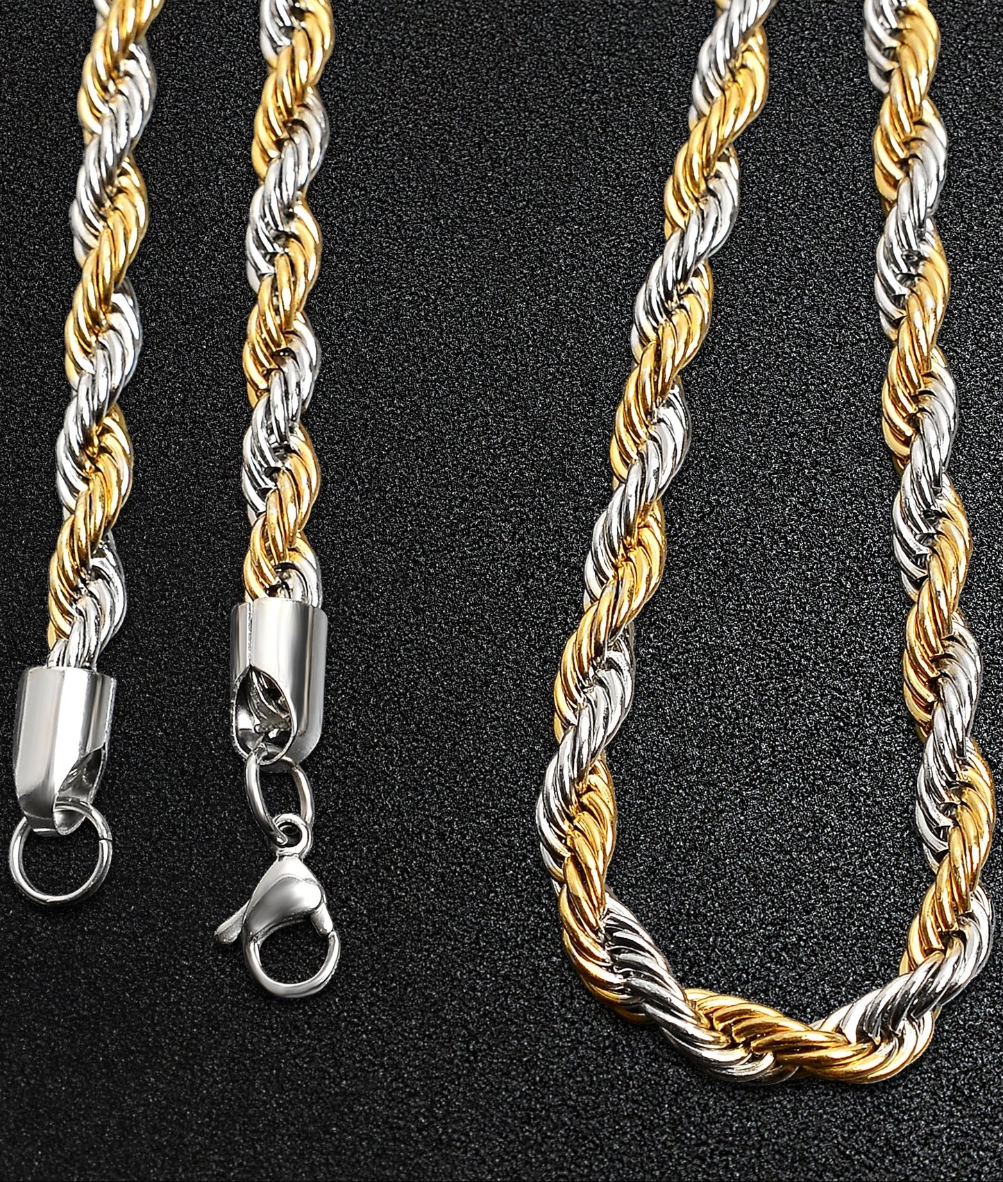 Two-tone gold and silver rope chain necklace on a black background