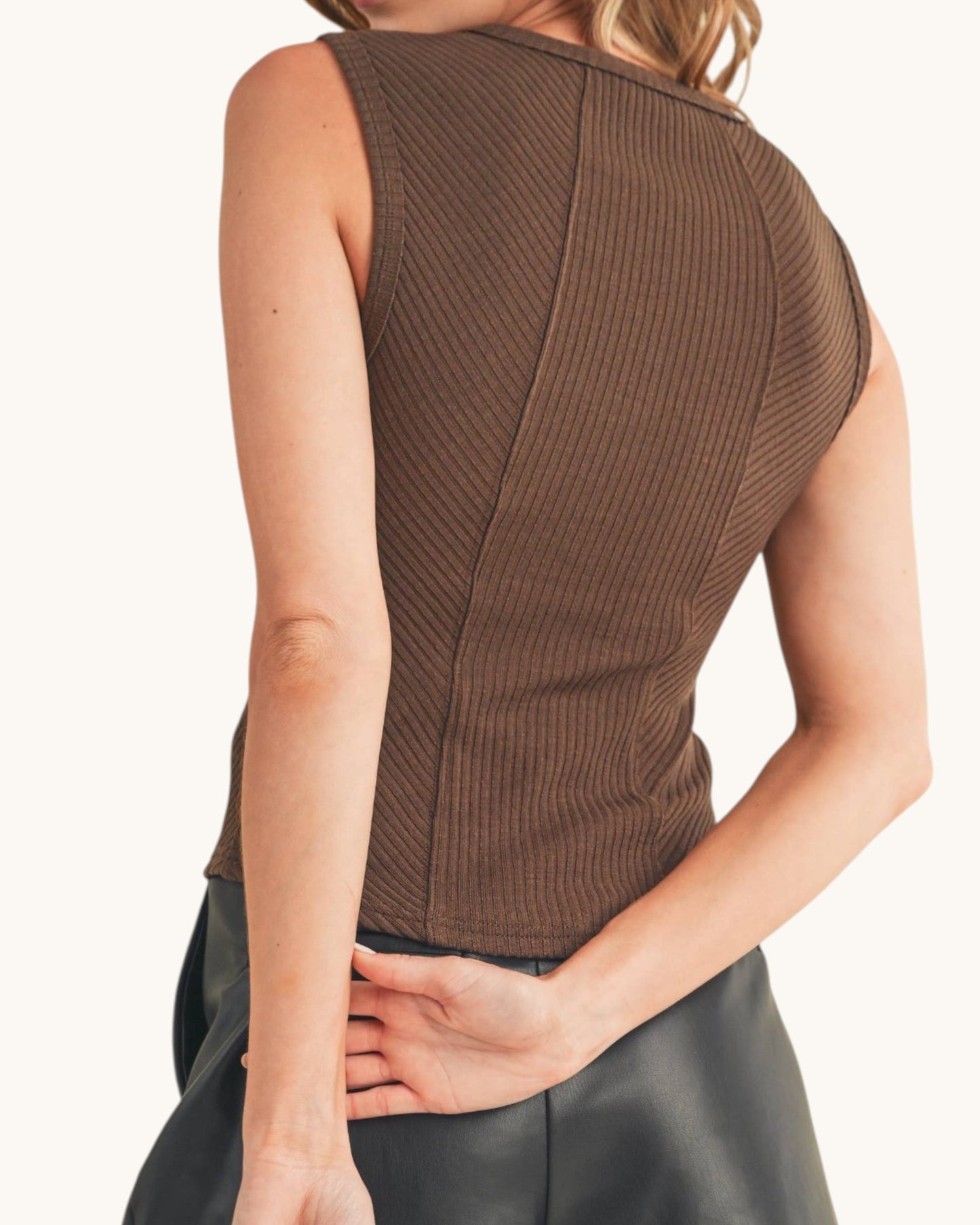 Back view of a woman wearing a ribbed sleeveless top with sweetheart neckline in chocolate color.