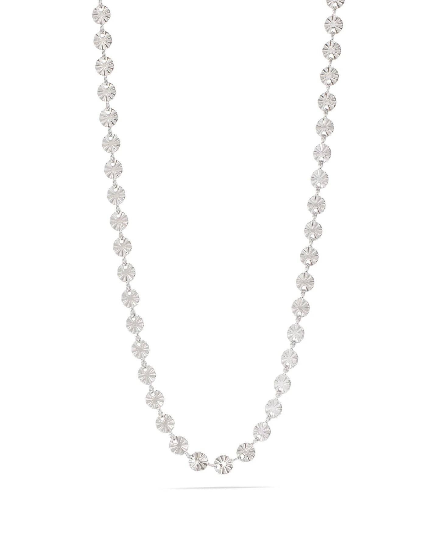 Silver sunburst necklace on a white background.