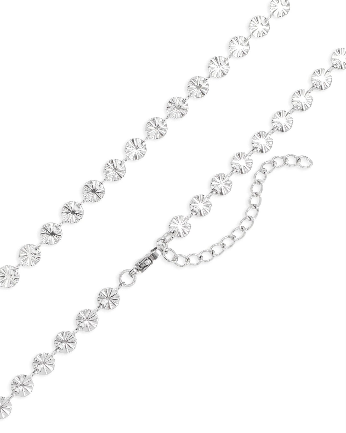 Silver starburst necklace on a white background.