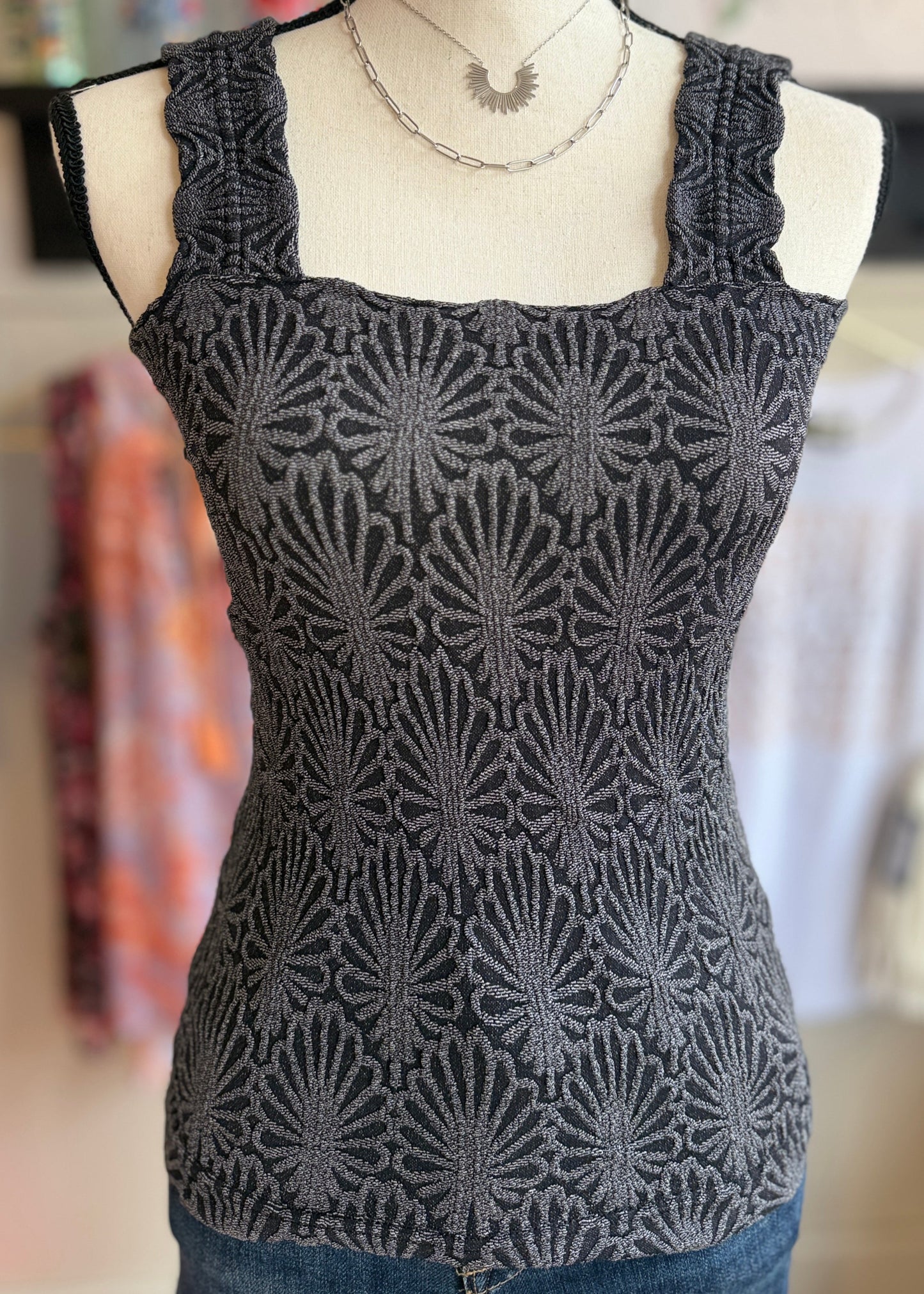 Charcoal textured tank top on a mannequin.