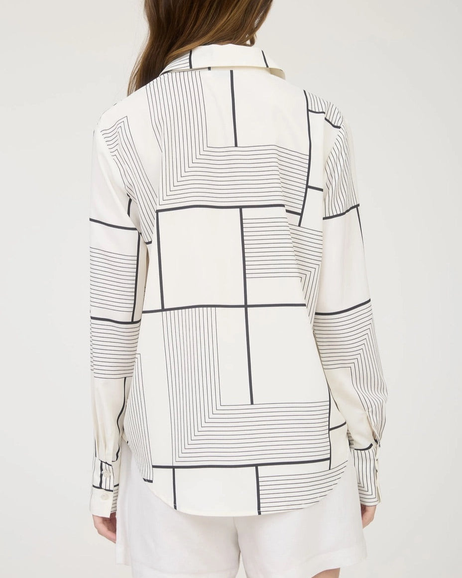 Black and white geometric print button down shirt with collared neckline.