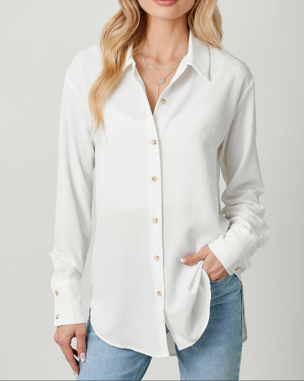 White textured lightweight button-down shirt with collared neckline.