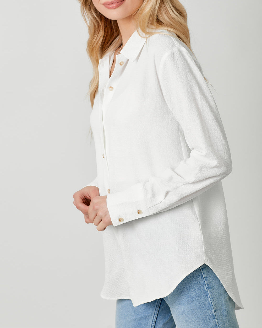 White textured lightweight button-down shirt with collared neckline.