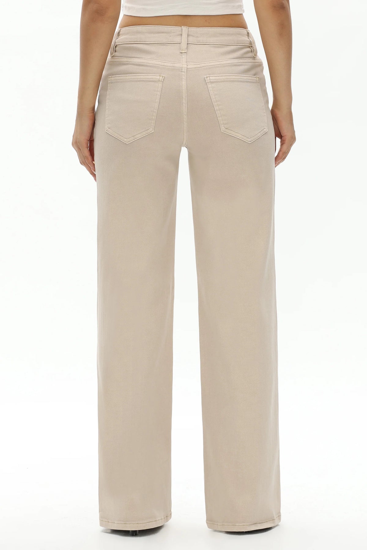 A person shown from the back wearing light beige wide-leg jeans with a straight-to-medium leg and two back pockets, photographed against a plain white studio background.
