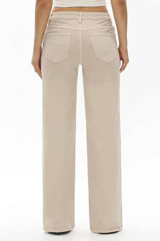 A person shown from the back wearing light beige wide-leg jeans with a straight-to-medium leg and two back pockets, photographed against a plain white studio background.