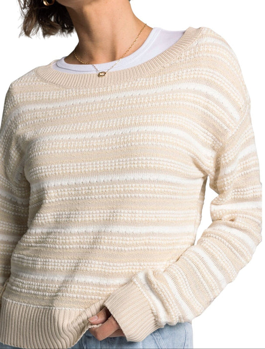 White and light beige textured knit sweater with boat neckline and relaxed fit.