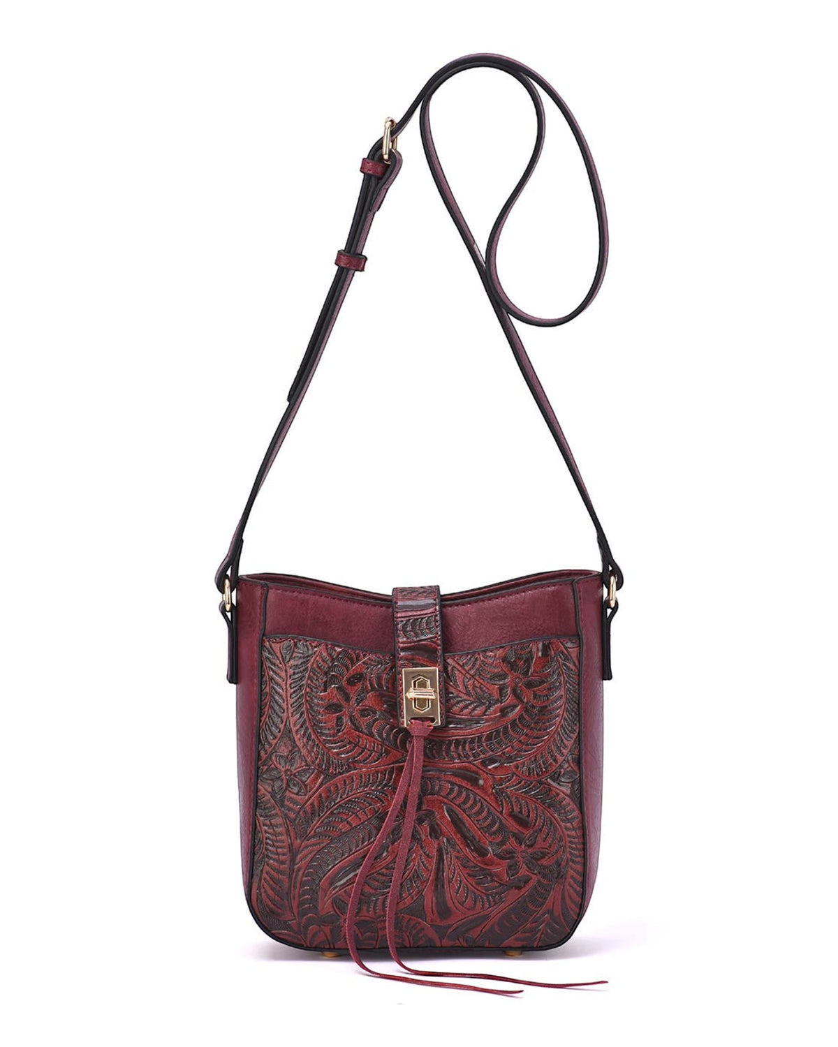 A dark red leather/burgundy crossbody bag with intricate hand-tooled floral patterns on the front flap, a matching adjustable shoulder strap, and a small gold-tone turn-lock clasp, shown against a plain white background.