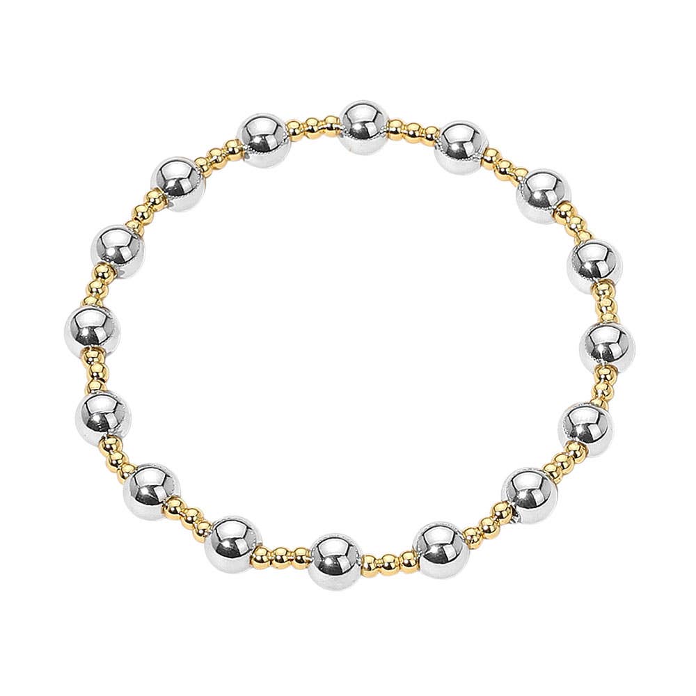 Bracelet with alternating gold and silver beads on a white background.