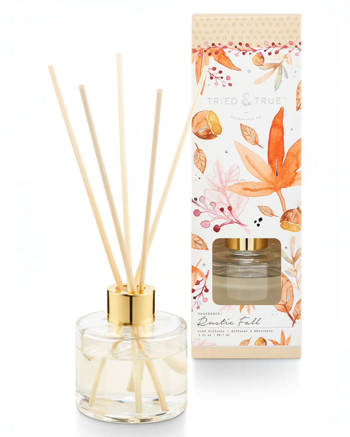 Rustic fall reed diffuser showing a glass vessel with gold cap and wood reeds next to a seasonal fall box with autumn graphics.