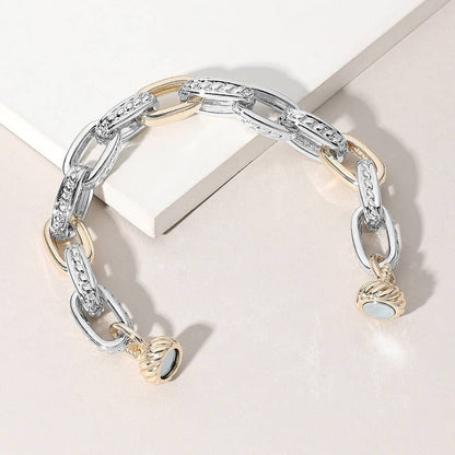 Silver and gold chain bracelet on a white background.